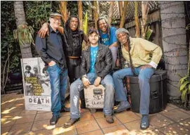  ?? Ricardo Dearatanha
Los Angeles Times ?? FILMMAKERS JEFF HOWLETT, left, and Mark Covino, middle, tell the story of Bobby Hackney Sr., second from left, Dannis Hackney and Bobbie Duncan.