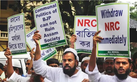  ?? AP ?? Activists of the All Bengal Minority Youth Federation shout slogans as they protest against the National Register of Citizens bill and lynching of a Muslim in Rajasthan’s Alwar in Kolkata yesterday.