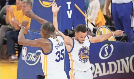  ??  ?? The Finals’ first two games were dominated by the Warriors’ Kevin Durant (35.5 points) and Stephen Curry (30 points), right.