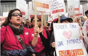  ??  ?? Kaiser employees strike in May 2011 over a contract impasse after 1,100 nurses switched to NUHW in January 2010.