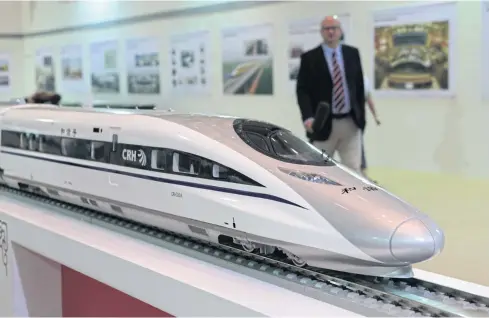  ?? CHANAT KATANYU ?? A high-speed train exhibition in Bangkok. The government hopes that more attractive terms, including the prospect of more than 50% ownership, will persuade foreign investors to bid for the high-speed railway linking three central airports.