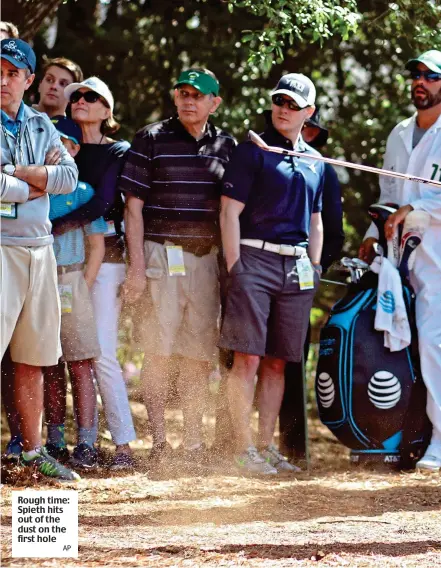  ?? AP ?? Rough time: Spieth hits out of the dust on the first hole