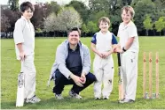  ??  ?? This sporting life: Phil Robinson with his three sons. He is thinking of taking up golf – the ultimate lazy man’s sport