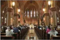  ?? LAUREN HALLIGAN - MEDIANEWS GROUP ?? Easter Sunday mass is held in the historic Cathedral of the Immaculate Conception in Albany.