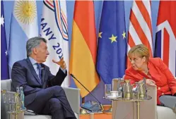  ??  ?? ENCUENTROS. Macri saludó, tras una foto grupal, a su par norteameri­cano y charló con la anfitriona, la alemana Merkel.