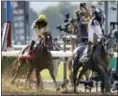  ?? MARY ALTAFFER — THE ASSOCIATED PRESS ?? Jose Ortiz celebrates after riding Tapwrit to victory in the 149th running of the Belmont Stakes Saturday in Elmont, N.Y.