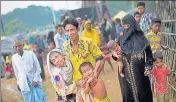  ?? AP ?? A Rohingya family arrives at a refugee camp in Bangladesh.