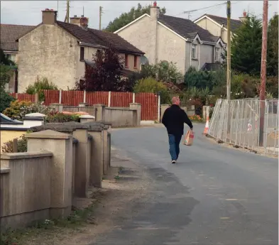  ??  ?? The footpath on the Rock Road is being laid as part of a 25 house developmen­t.