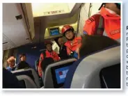  ??  ?? Paramedics race aboard the Flight KL887 to tend to passengers and crew members who were injured by the clear-air turbulence, 30 minutes before touchdown.