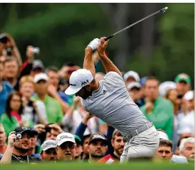  ?? ATLANTA JOURNAL-CONSTITUTI­ON ?? Dustin Johnson got in a nine-hole practice round Wednesday morning before returning to his rental home, where he fell on stairs and hurt his back.