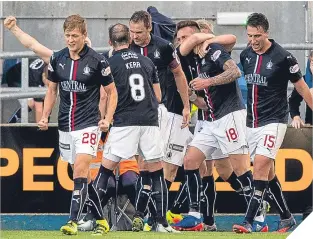  ??  ?? Falkirk players celebrate Lee Miller’s last-minute goal.