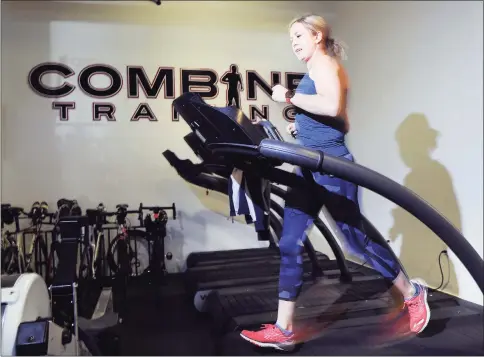  ?? Bob Luckey Jr. / Hearst Connecticu­t Media file photo ?? Greenwich resident Amy Dixon, a triathlete who is blind, works out at Combine Training in Greenwich on Jan. 4, 2017.