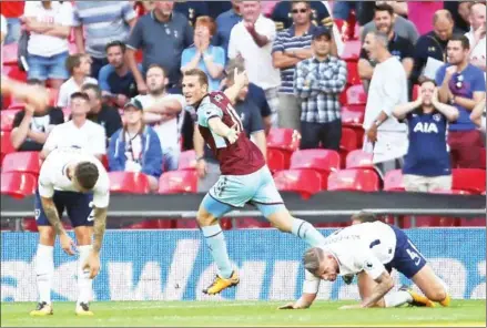  ?? DANIEL LEAL-OLIVAS/AFP ?? Burnley striker Chris Wood celebrates after scoring a late equaliser in the English Premier League match against Tottenham Hotspur at Wembley Stadium in London on August 27. The game finished 1-1.
