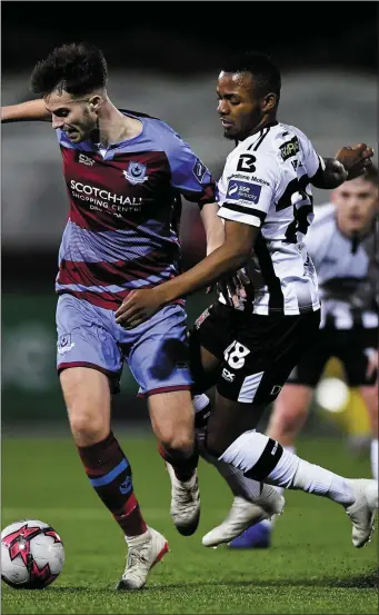  ??  ?? Drogheda’s Cian Kavanagh tries to shake off Lido Lotefa of Dundalk during the latter stages of Friday’s Jim Malone Cup match.