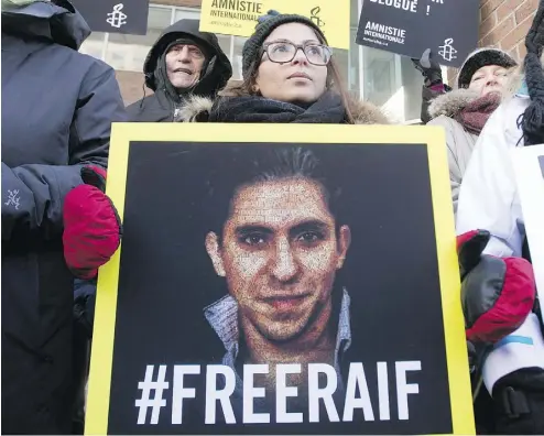  ?? RYAN REMIORZ / THE CANADIAN PRESS FILES ?? Ensaf Haidar, wife of blogger Raif Badawi, takes part in a rally for his freedom in Montreal in 2015. Badawi has been sentenced to 10 years in prison and 1,000 lashes for the crime of “insulting Islam through electronic channels.”
