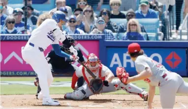  ?? GETTY IMAGES ?? After a standing ovation from a crowd of 52,667, Shohei Ohtani hit a double in his first at-bat for the Dodgers.