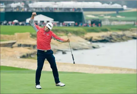  ?? Ross Kinnaird Getty Images ?? GARY WOODLAND celebrates his birdie on the par-five 18th Sunday that clinched a three-stroke win — his first major victory.