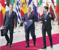  ?? PHOTOS: REUTERS ?? Not a fan of migrants . . . Hungary’s Prime Minister Viktor Orban (centre) arrives at a European Union leaders summit in Brussels, Belgium.