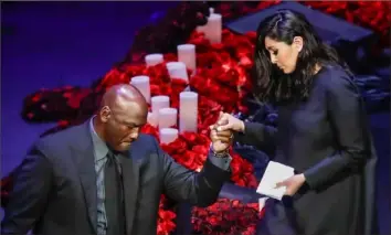  ?? Marcio Jose Sanchez/Associated Press ?? Former NBA player Michael Jordan helps Vanessa Bryant off the stage after she spoke during a celebratio­n of life for her husband, Kobe Bryant, and daughter Gianna on Monday.