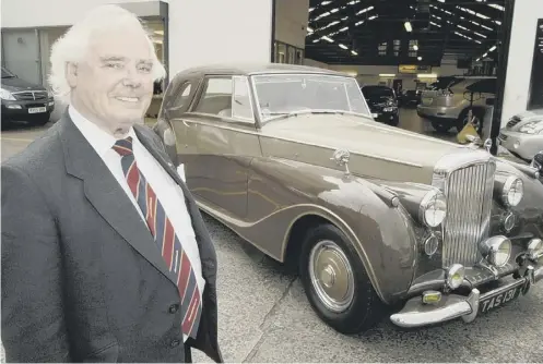  ?? PICTURE: SWNS.COM ?? 0 Sir Arnold with his 1948 Bentley Mark VI Sedanca coupé in 2005