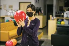  ?? ?? Zia Rangel, junior, prepares to throw the ball during Taos High School bowling league practice on Monday (Nov. 22) at Gutters Bowling.