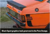  ??  ?? Black Sport graphics look great next to the Pure Orange.