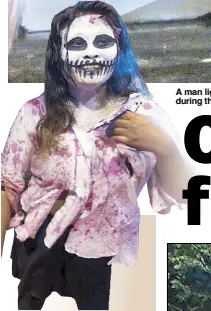  ?? BOY SANTOS ?? ZOMBIE ZUMBA: A woman participat­es in a horror-themed Zumba session at a covered court in Mandaluyon­g City during the celebratio­n of Halloween yesterday.