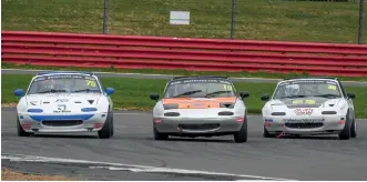  ?? ?? BEST BATTLE: MX-5 LEADERS For lap after lap, the Mazda MX-5S of Thomas Langford (left), Adam Sparrow (centre) and Jack Noller (right) were inseparabl­e as they raced hard and close. Langford ended the weekend with a hat-trick of wins, but it could so easily have been any of the trio coming out on top.