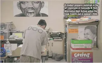  ??  ?? A student prepares materials in the art classroom at Consuella B. York Alternativ­e High School within the Cook County Jail in January 2016. SUN- TIMES FILE PHOTO