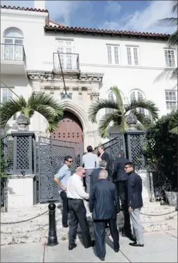  ?? PICTURE: AP ?? People attend the auction of the South Beach mansion that once belonged to Gianni Versace. The property, which sold for $41.5 million, was bought by Versace in 1992. He was fatally shot on its steps in 1997 by a serial killer. His family sold it in...