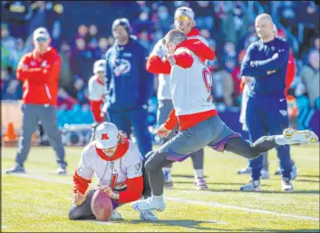  ?? L.E. Baskow Las Vegas Review-journal @Left_eye_images ?? Raiders punter/holder AJ Cole holds the ball in place for AFC Pro Bowl kicker Justin Tucker of the Ravens during Thursday’s practice at Las Vegas Ballpark.