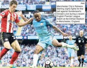  ?? FILE ?? Manchester City’s Raheem Sterling (right) fights for the ball against Sunderland’s Donald Love during a recent English Premier League match at the Etihad Stadium in Manchester, England.