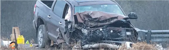  ??  ?? The scene after a pickup truck crashed into a police cruiser at Kawartha Lakes, Ont., on Friday. Officers opened fire; a boy in the backseat died.