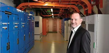 ?? Photos: Bev Lacey ?? BOLD MOVE: Pulse Data Centre general manager Peter Blunt explains the state-of-the-art transforme­rs and electrical systems, designed by Schneider Electric, which guarantees power supplies at all times at the facility.