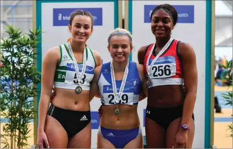  ??  ?? Women’s 60m medallists, from left, Ciara Neville of Emerald AC, Co. Limerick, silver, Molly Scott of St Laurence O’Toole A.C., Co. Carlow, gold, and Patience Jumbo-Gula of Dundalk St. Gerards AC, Co. Louth, bronze.
