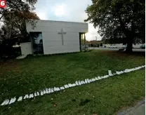  ??  ?? 6 Fifty pairs of painted white shoes are laid out at All Souls Church in memory of the victims PHOTO CREDIT: AFP, REUTERS, AP