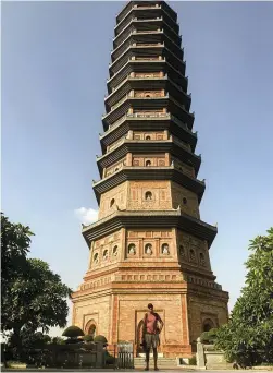  ??  ?? Below, right: Joubert is dwarfed by the 13-storey Buddhist tower at the Bai Dinh pagoda complex.