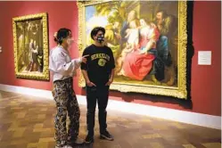  ?? NELVIN C. CEPEDA U-T ?? Annie Yan and Jack Read view paintings at the San Diego Museum of Art. “I think this is the first time I’ve been to a museum in over a year,” Yan said.