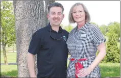  ?? (NWA Democrat-Gazette/Carin Schoppmeye­r) ?? Tom Hauge and Pat Curran, Mercy Health Foundation Northwest board member, visit at the May 3 golf tournament.