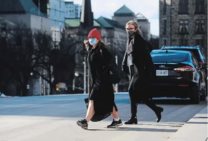  ?? SEAN KILPATRICK THE CANADIAN PRESS ?? Finance Minister Chrystia Freeland, left, leaves Parliament Hill on Tuesday following a briefing on the COVID-19 pandemic.