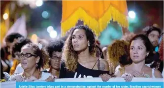  ??  ?? Anielle Silva (center) takes part in a demonstrat­ion against the murder of her sister, Brazilian councilwom­an and activist Marielle Franco, in front of Rio’s Municipal Chamber on Tuesday. —AFP