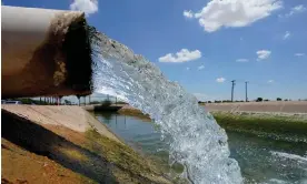  ?? Photograph: Matt York/AP ?? Water from the Colorado River fills an irrigation canal in Maricopa, Arizona. The historic reduction that will probably trigger significan­t water restrictio­ns.