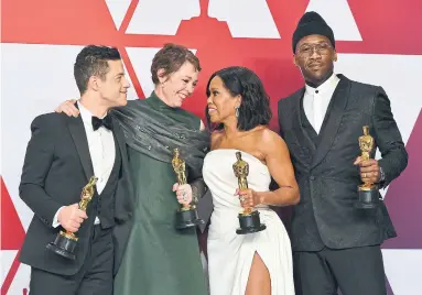  ?? JORDAN STRAUSS INVISION/THE ASSOCIATED PRESS ?? The Oscar-winning actors pose after Sunday’s Academy Awards; from left: Rami Malek ( Bohemian Rhapsody), Olivia Colman ( The Favourite), Regina King ( If Beale Street Could Talk) and Mahershala Ali ( Green Book).