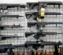  ?? AP ?? AR-15-style rifles are on display at Burbank Ammo & Guns in Burbank, California. Gun manufactur­ers have made more than $1.6 billion from selling AR15-style guns over the past decade, and for two companies those revenues have tripled over the last three years, a House investigat­ion has unveiled.