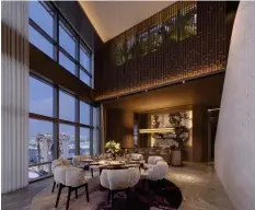  ?? ?? Rendering of the informal dining room on the 53rd floor with a view of Marina Bay