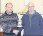  ?? (Pic: The Avondhu Archives) ?? Glanworth’s Patsy Egan (right) pictured in December 2013, having retired from Cork County Council (CCC) after 33 years, pictured receiving a clock from Paul Casey, CCC foreman, to honour his commitment and years of service.