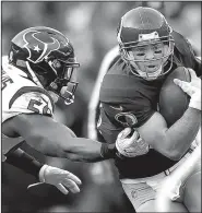  ?? AP/PABLO MARTINEZ MONSIVAIS ?? Washington Redskins quarterbac­k Colt McCoy runs past Houston Texans outside linebacker Whitney Mercilus during the second half Sunday in Landover, Md. McCoy will start Thursday against the Dallas Cowboys in place of Alex Smith, who suffered a season-ending injury Sunday.