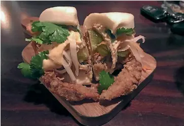  ?? JANAN JAY/STUFF ?? Salt & pepper soft shell crab bao, pickled cucumber and kimchi mayo.