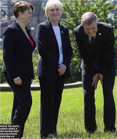  ??  ?? United: The party leaders share a joke during their announceme­nt yesterday on Holyrood powers