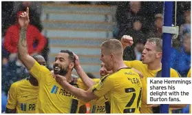  ?? ?? Kane Hemmings shares his delight with the Burton fans.